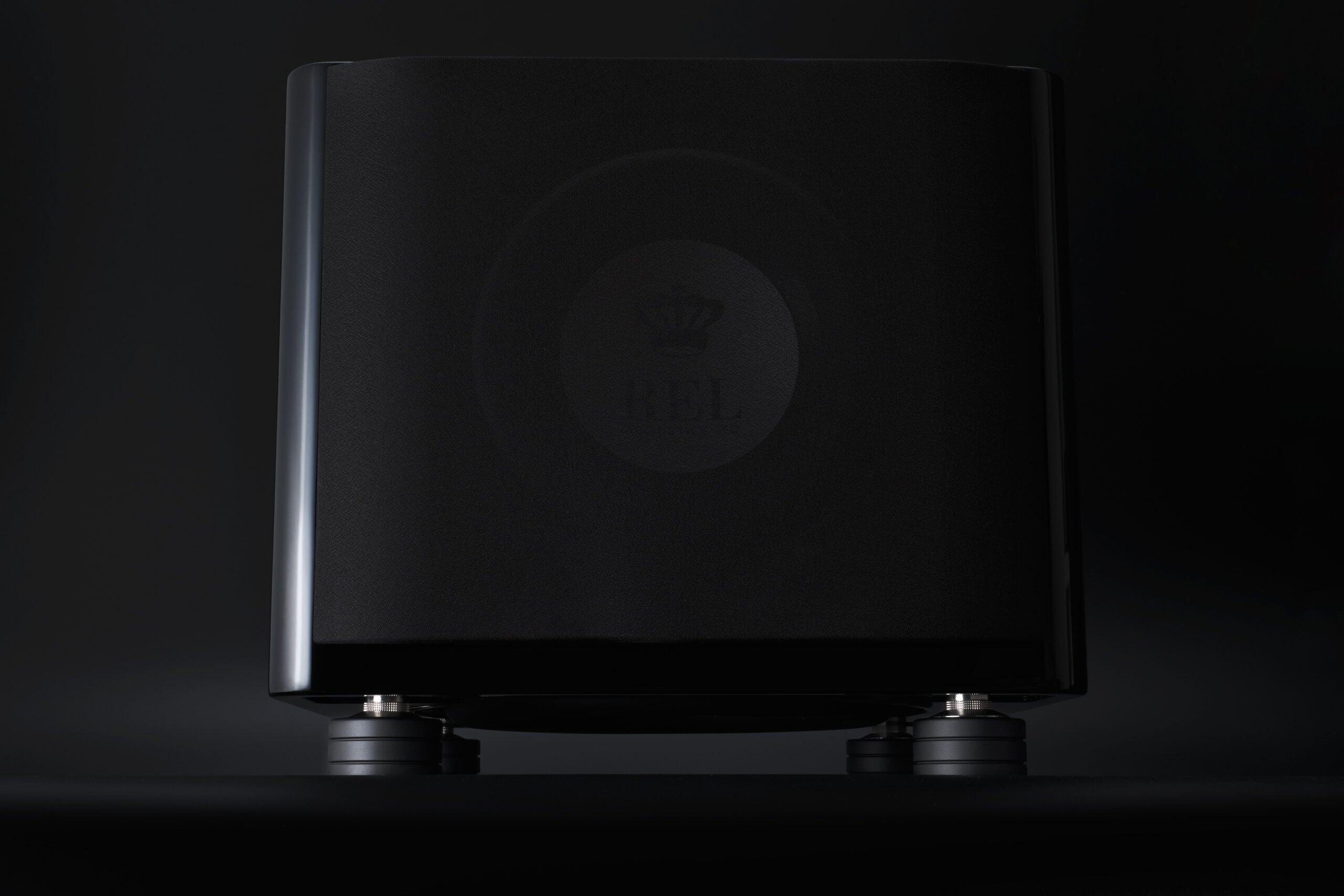 REL subwoofer on isolation feet reducing floor vibration in listening room
